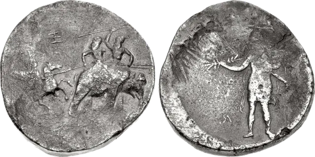 Silver elephant medallion: a horseman attacks two riders on a war elephant, and a standing figure holds a thunderbolt as Nike crowns him