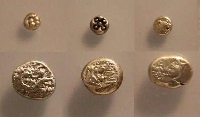 Early electrum coins found in the foundations of the Temple of Artemis at Ephesus, showing lions, a lion's paw and a boar
