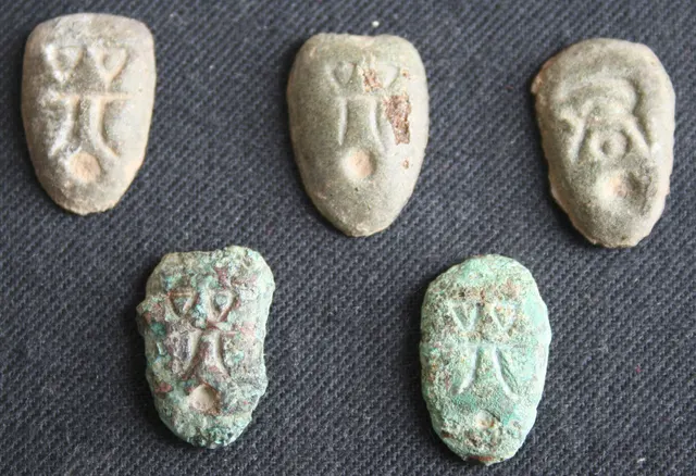 Five small bronze "ant-nose" coins from the state of Chu, shaped like cowrie shells