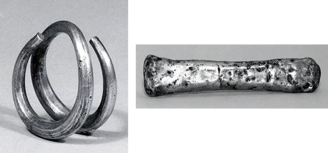 A spiral silver coil and a small silver bar from western Iran, used as money by weight before coins