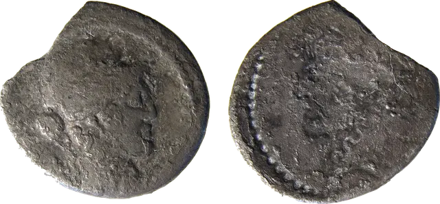 Roman silver coin with a raised head on one side and the same head sunken and mirrored on the other, a minting error called a brockage