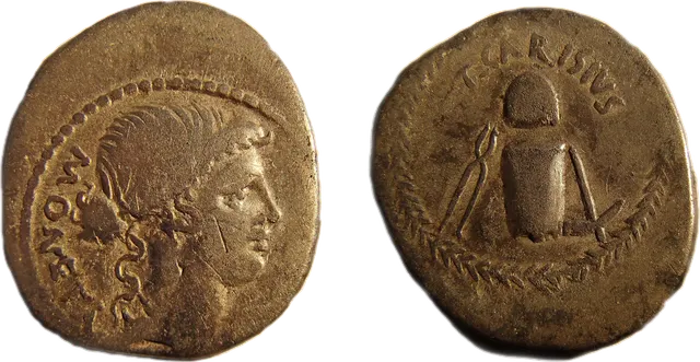 Roman silver denarius showing the goddess Moneta on one side and an anvil, hammer, tongs and cap on the other