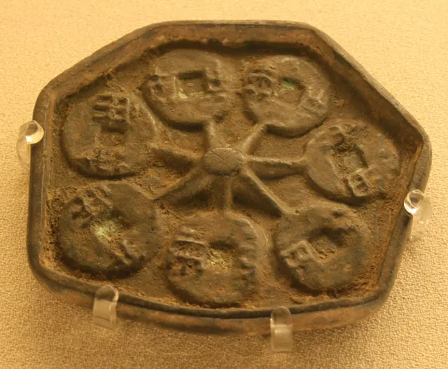 Bronze master mould from the Western Han dynasty with rows of coin-shaped cavities for casting ban liang coins
