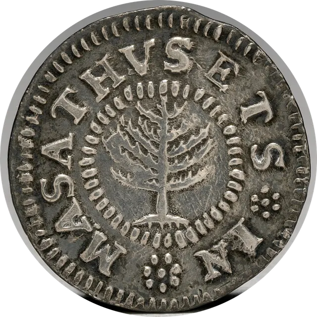 Silver Pine Tree shilling showing a pine tree inside a beaded ring, with the legend MASATHVSETS IN