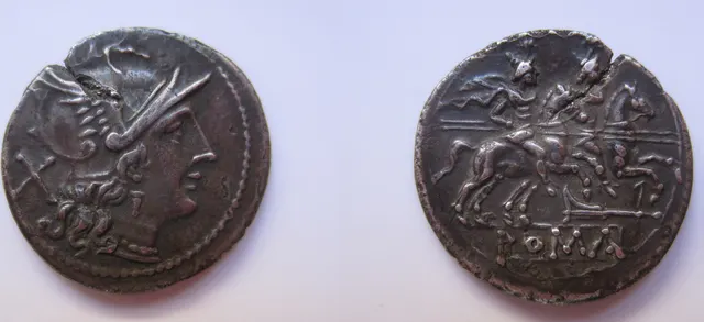 Early silver denarius of the Roman Republic, struck between 211 and 194 BC: helmeted Roma with the X value mark, and the Dioscuri on horseback above the word ROMA