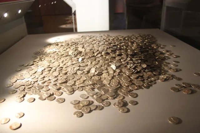 A large heap of Roman silver denarii from the Shapwick Hoard on display at the Museum of Somerset