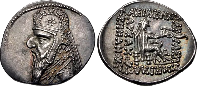 Parthian silver drachm of Mithridates II: the king in a jewelled tiara, and a seated archer with a Greek inscription