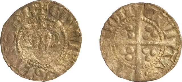 Hammered silver penny of Edward I with a crowned king's face and a long cross on the back