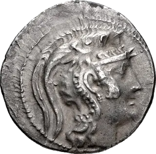 Silver tetradrachm of Athens: helmeted head of Athena on the front, an owl with an olive sprig on the back
