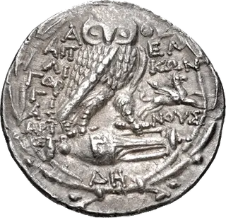 Silver tetradrachm of Athens: helmeted head of Athena on the front, an owl with an olive sprig on the back