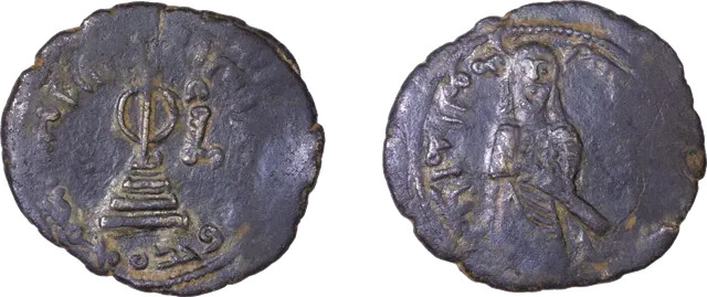 Copper fals of the standing-caliph type, with a pole on a stepped base on one side and the standing caliph on the other