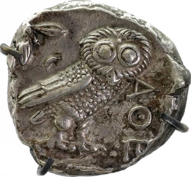 Reverse of an Athenian tetradrachm with an owl, olive sprig, crescent moon and the letters ΑΘΕ