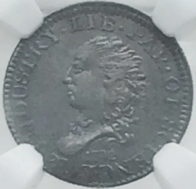 Front of a 1792 half disme in a grading holder, showing a small Liberty head facing left