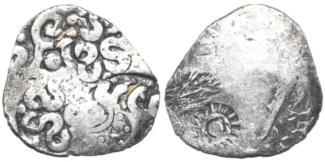 Broad, thin silver punch-marked coin of the Kashi Janapada under Kosala, about 525 to 465 BC, with repeated symbols on one face