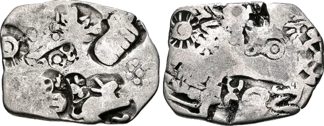 Both sides of a silver karshapana of the Magadha kingdom, about 350 BC, crowded with sun, wheel and animal punch-marks