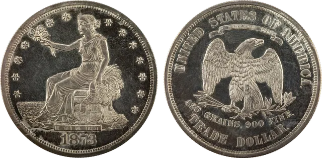 1873 trade dollar: Liberty seated on a bale facing the sea, and an eagle above the words "420 GRAINS, 900 FINE"