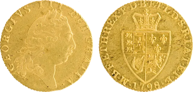 George III "spade" guinea of 1798: the king's portrait, and a crowned shield shaped like the spade on a playing card