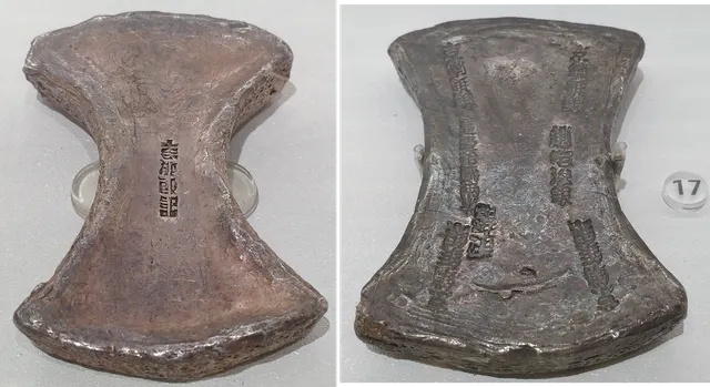 Two flat, waisted Southern Song silver ingots: a 5-tael ingot with a single maker's stamp in the centre, and a 12½-tael ingot with columns of engraved inscriptions