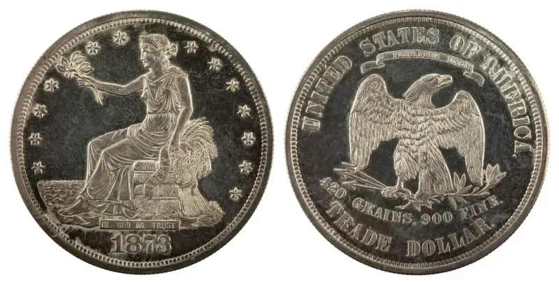 1873 trade dollar: Liberty seated on a bale facing the sea, and an eagle above the words 420 GRAINS, 900 FINE and TRADE DOLLAR