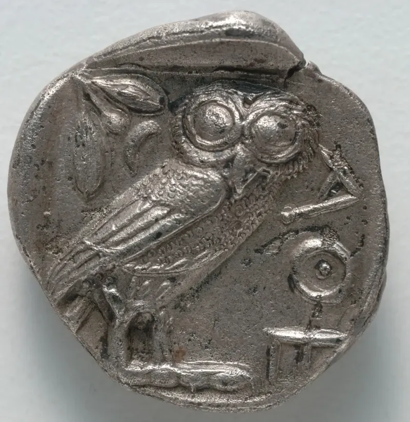 Reverse of the same tetradrachm: a standing owl with an olive sprig, crescent moon and the letters ΑΘΕ