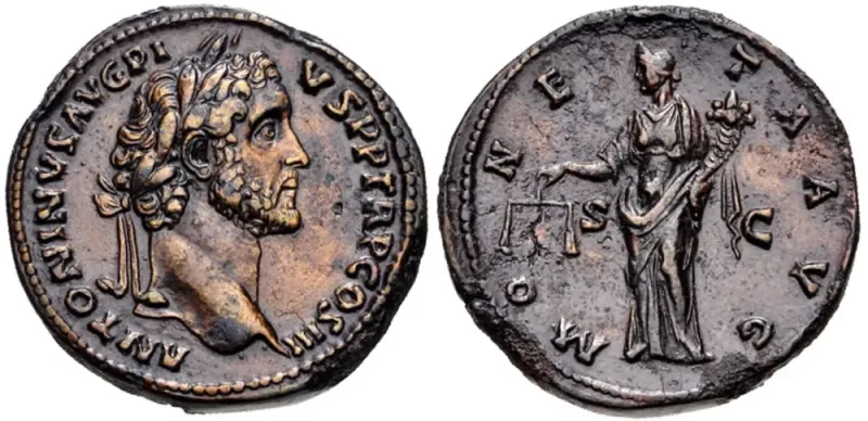 Brass sestertius of Antoninus Pius, AD 143: laureate portrait on the front, and on the back Moneta, goddess of the mint, holding scales and a cornucopia